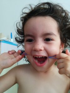 Emanuelle 2.9 y/o using the Gummy Floss™ and having fun!